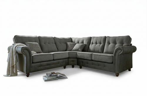 Barcelona grey fabric corner sofa with tufted cushions and studded arms.