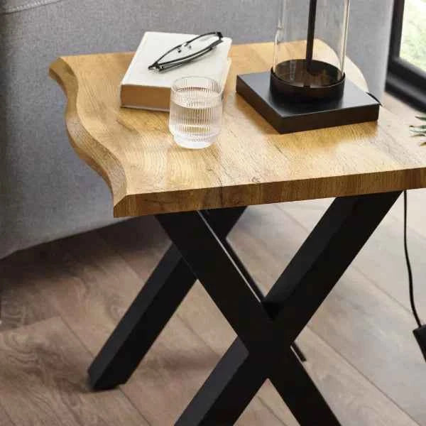 Wooden lamp table with black X-shaped legs.