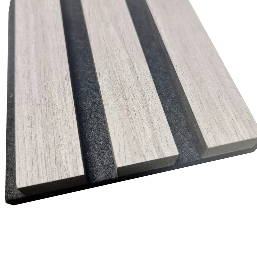 Acoustic wood slatted wall panels with a light wood grain texture.