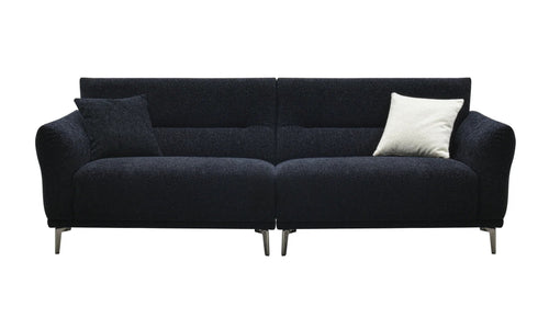 A black bouclé fabric sofa with two throw pillows.