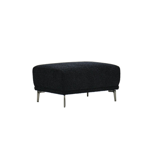 A black bouclé fabric ottoman with silver legs.