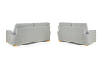 Two grey fabric sofas with wooden legs shown from the back.