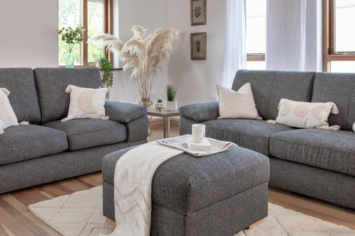 Bento fabric sofa collection in slate grey with decorative pillows and ottoman.