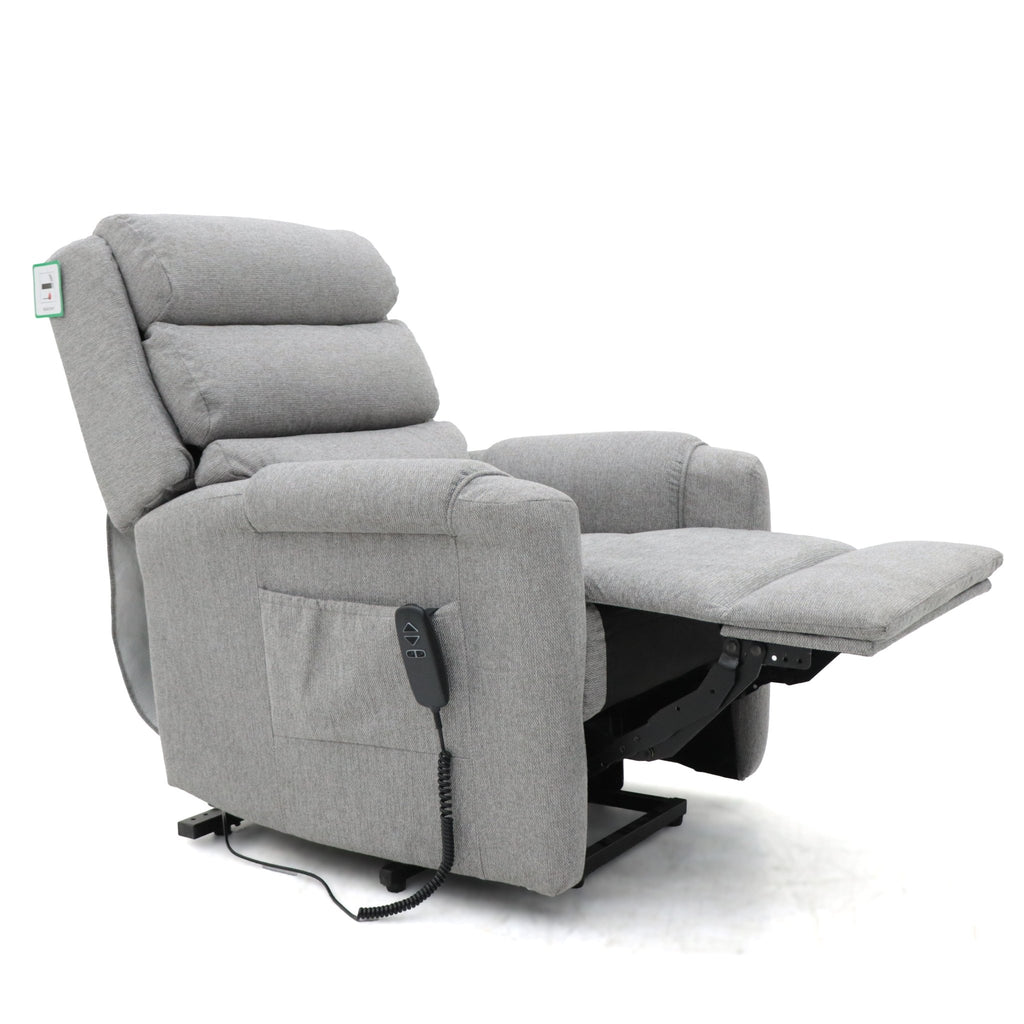 Grey fabric dual motor rise and recline armchair with extended footrest.