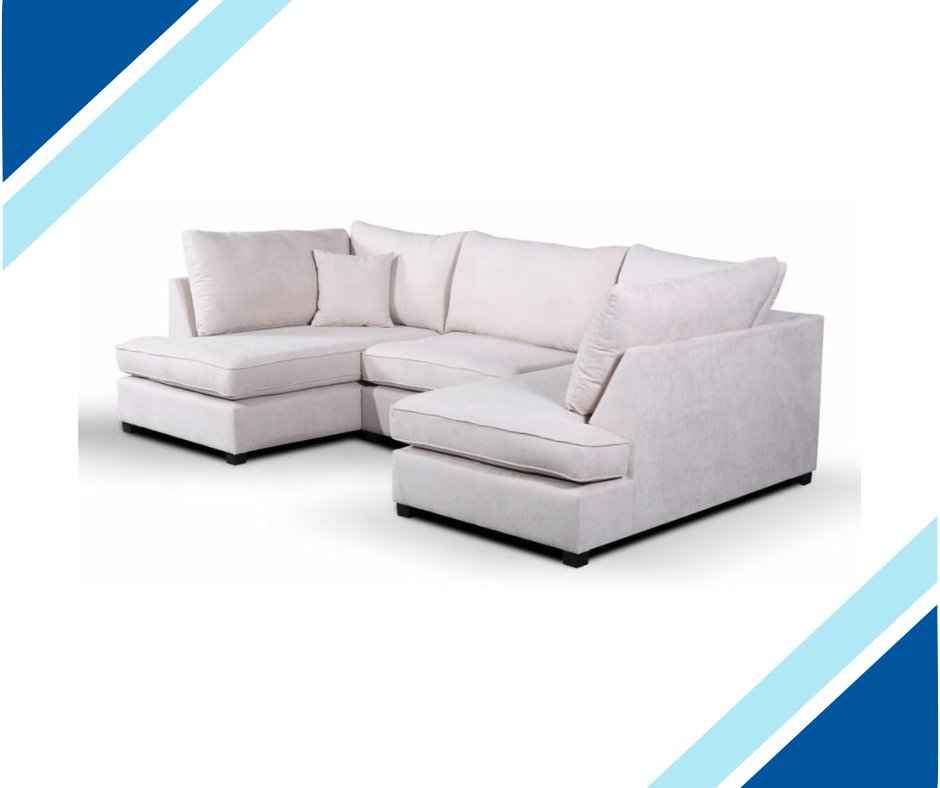 U-shaped fabric corner sofa with plush cushions and a footstool.