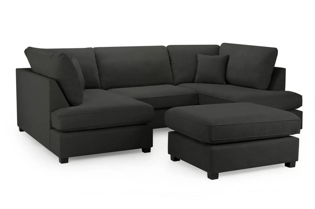 U-shaped dark gray fabric sectional sofa with a matching ottoman.