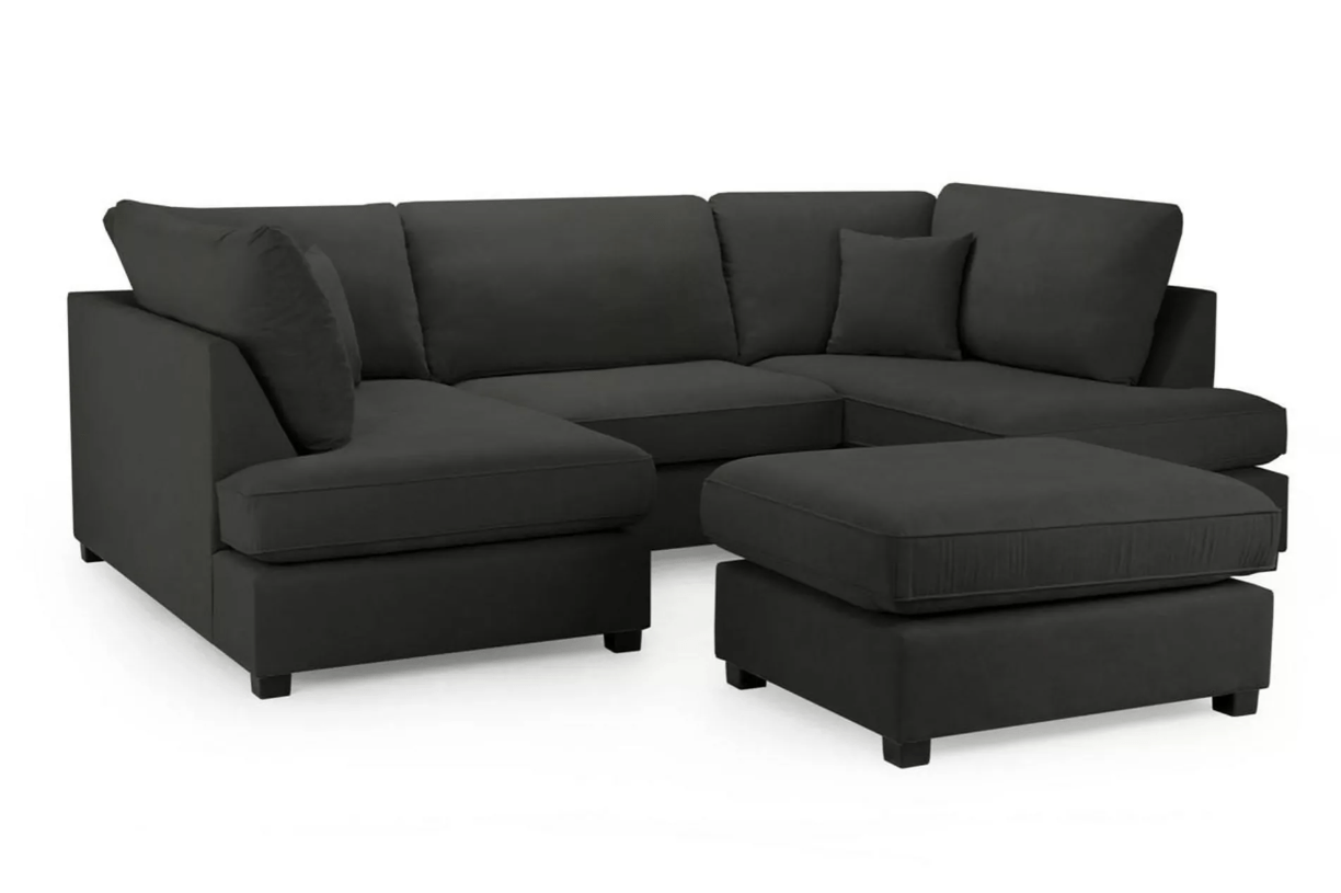 U-shaped dark gray fabric sectional sofa with a matching ottoman.