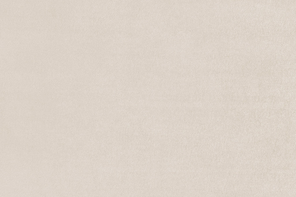 Carnabie U shaped plush velvet corner sofa in a light neutral color.