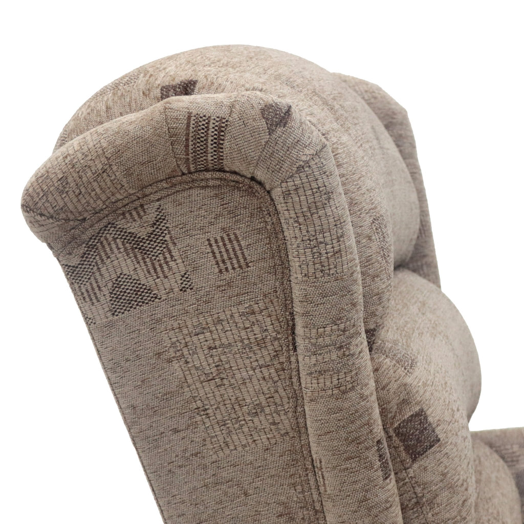 A close-up of a tan armchair with a subtle geometric pattern.