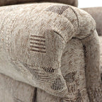 Close-up of a textured, patterned fabric on a rise and recline armchair.
