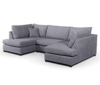 U-shaped grey fabric corner sofa with plush cushions.