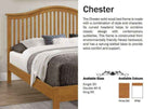 Chester solid wood bed frame with a curved headboard and slatted base.