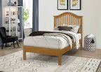 Chester solid wood bed frame with a curved slatted headboard in a natural wood finish.