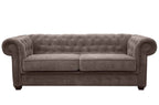 A brown fabric Chesterfield sofa bed with tufted back and rolled arms.