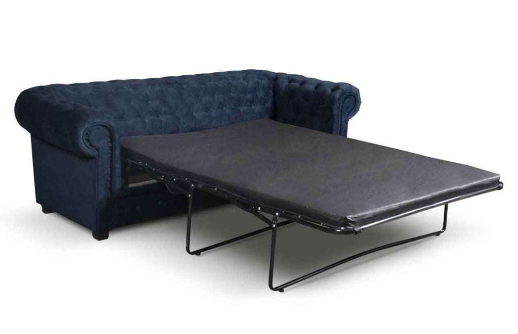 Navy blue fabric Chesterfield sofa bed with a pull-out mattress.