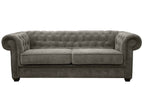 Grey fabric Chesterfield sofa bed with tufted back and rolled arms.