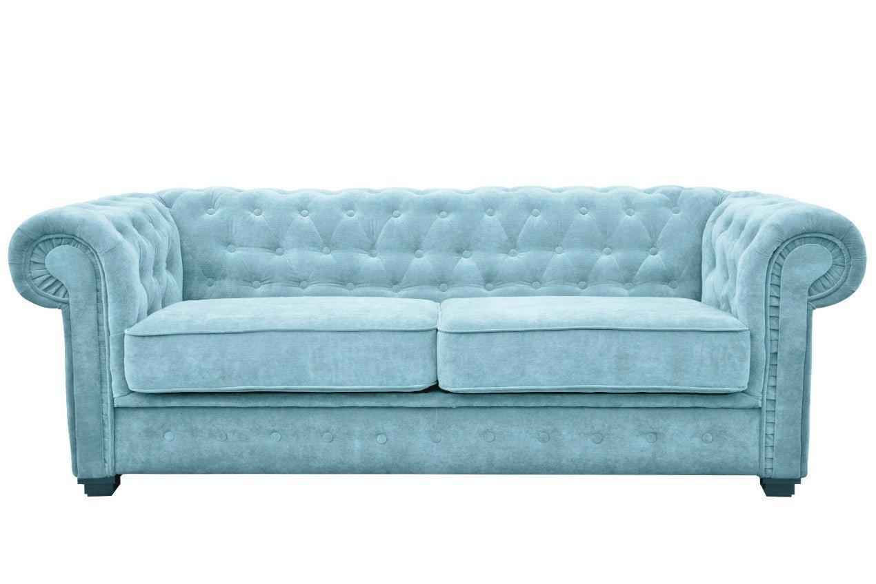 A light blue fabric Chesterfield sofa bed with tufted back and rolled arms.