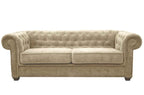 A beige fabric Chesterfield sofa bed with tufted back and rolled arms.
