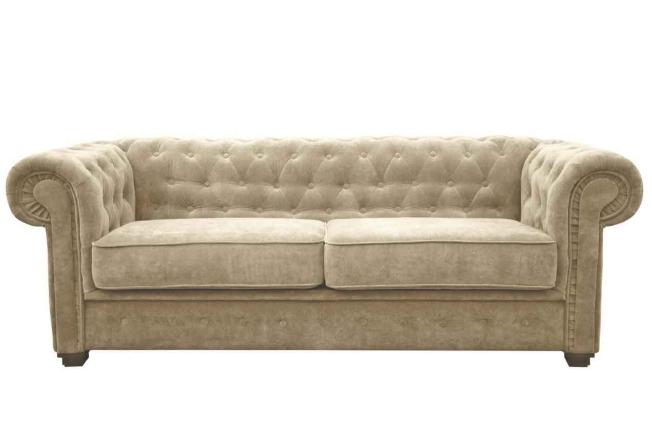 A beige fabric Chesterfield sofa bed with tufted back and rolled arms.