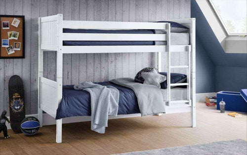 The Bella Bunk Bed in white with navy bedding.