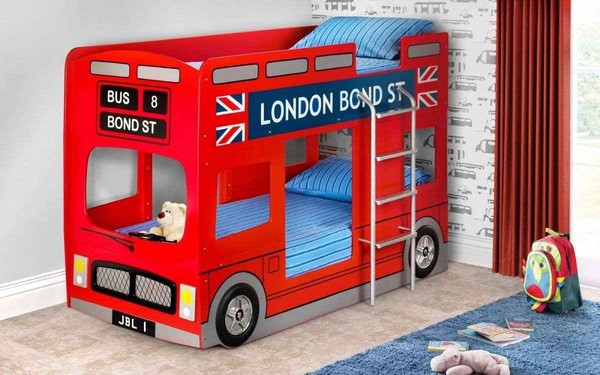 A red London bus bunk bed with blue striped bedding and a teddy bear.