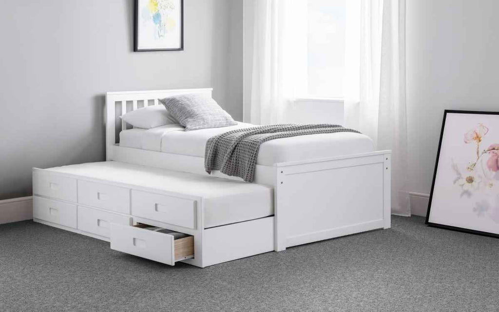 White wooden captain's bed with pull-out underbed and storage drawers.