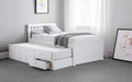 White wooden captain's bed with pull-out underbed and storage drawers.
