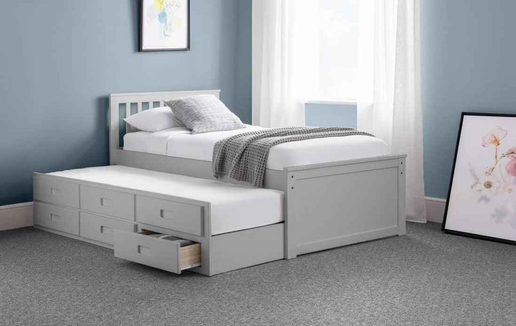 Grey wooden captain's bed with a pull-out trundle and six storage drawers.