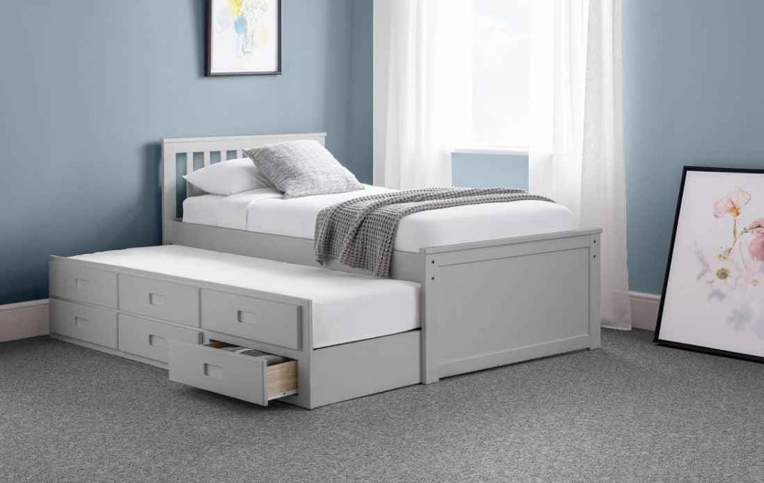 Grey wooden captain's bed with a pull-out trundle and six storage drawers.