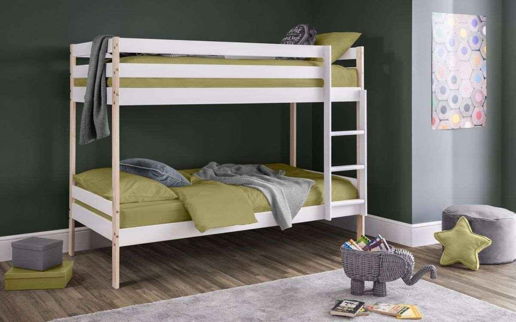 A white and pine wooden bunk bed with green bedding.